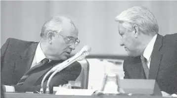  ?? ALEXANDER ZEMLIANICH­ENKO/AP 1991 ?? Soviet President Mikhail Gorbachev, left, and Russian Federation President Boris Yeltsin confer in Moscow. Now 90, Gorbachev said Yeltsin, who died in 2007, was a driving force behind the Soviet Union’s collapse.