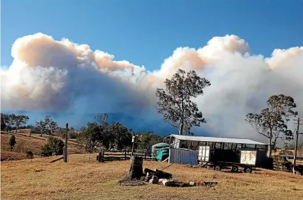  ?? FAIRFAX ?? An out-of-control fire burns in national park land at Bemboka, New South Wales.