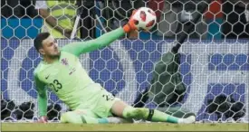  ?? REBECCA BLACKWELL — THE ASSOCIATED PRESS ?? Croatia goalkeeper Danijel Subasic makes a save during the penalty shootout against Russia’s Fyodor Smolov during a World Cup quarterfin­al match in the Fisht Stadium, in Sochi, Russia on July 7.