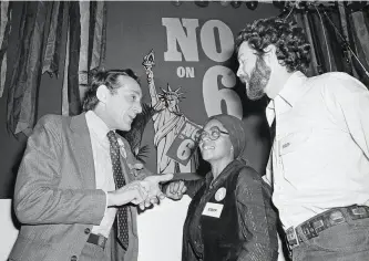  ?? Sal Veder / Associated Press 1978 ?? San Francisco Supervisor Harvey Milk ( left) talks with Gwenn Craig and Bill Kraus, cocoordina­tors of San Francisco No on Prop. 6 in S. F. in 1978. The controvers­ial propositio­n would have fired homosexual teachers from schools. It didn’t pass.