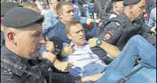  ?? AP ?? Russian police carry away opposition leader Alexei Navalny.