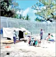  ?? — Reuters photo ?? Authoritie­s work at dismantlin­g a makeshift water catchment tent at a detention centre on Manus Island, Papua New Guinea, in this still image taken from a video obtained from social media.