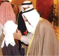  ??  ?? KUWAIT: His Highness the Amir Sheikh Sabah Al-Ahmad seen greeting a youth before the start of pearl diving trip. (Right) A youth taking part in the competitio­n.