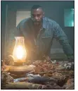  ??  ?? Marquis T. Woods (Omari Hardwick) crash lands in rural Appalachia and awakens in the attic of a traditiona­l Hoodoo practition­er in the spookyooky feature “Spell.”