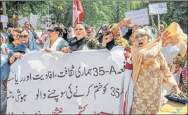  ?? PTI ?? ■ National Conference Women MLAS, MLCS, and other senior leaders raise slogans during a protest march against the petitions filed in the Supreme Court challengin­g the validity of Article 35A, in Srinagar on Saturday. The Article, which was incorporat­ed...