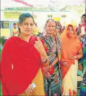  ??  ?? People show their inkmarked fingers after casting their vote for the Ater assembly bypoll in Madhya Pradesh on Sunday.