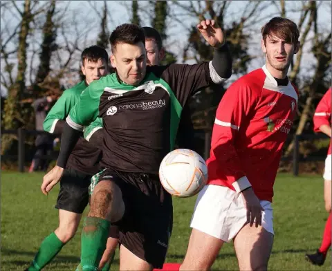  ??  ?? Barry Coughlan of Crossabeg is tracked by Paudie Barden of Raheen during their Neil O’Sullivan Cup first round match.