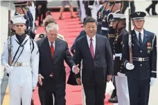  ?? JOE RAEDLE, GETTY IMAGES ?? Secretary of State Rex Tillerson walks with Chinese President Xi Jinping upon arrival in West Palm Beach, Fla.