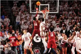  ?? Arena. Photograph: Jeff Blake/USA Today Sports ?? Alabama Crimson Tide forward Brandon Miller (24) makes the game-winning shot against the South Carolina Gamecocks in overtime on Wednesday night at Colonial Life