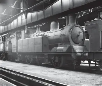  ?? L W Perkins/Kiddermins­ter Railway Museum H C Casserley ?? A glimpse inside Treherbert shed allows us to appreciate the full-length smoke ventilatio­n system designed to improve the working atmosphere for shed staff and locomotive crews, although all is quiet and smoke free as this is a Sunday shed visit on 23 July 1939. Centre stage is Hurry Riches-designed ‘O4’ class 0-6-2T No 302, his last design and one of 41 of these mixed traffic engines. Doubtless it was felt to be a worthy photograph­ic subject as it was not yet adorned with a Standard No 3 boiler, and in this instance it would never receive one; 37 of the class did. New as Taff Vale Railway No 104 in July 1908 – Beyer, Peacock & Co Ltd Works No 5101 – this locomotive would serve until April 1948.