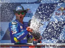  ??  ?? Iannone celebrates his first ever podium for Suzuki