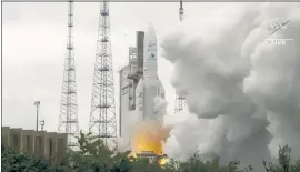  ?? NASA VIA AP ?? Arianespac­e’s Ariane 5 rocket with NASA’s James Webb Space Telescope onboard lifts off Saturday at Europe’s Spaceport, the Guiana Space Center in Kourou, French Guiana.