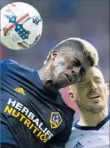  ?? Darryl Dyck Associated Press ?? GYASI ZARDES, battling Vancouver’s Jordan Harvey, has made an impact in MLS, for U.S. national team and with work in his community.