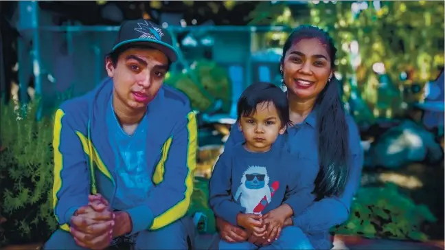  ?? RAY CHAVEZ — STAFF PHOTOGRAPH­ER ?? Isaac Cardenas, 16, left, his 22-month-old brother Nikolaas Cardenas and their mother Yadira Mederos de Cardenas of Menlo Park. Isaac, who was diagnosed with autism as a child gets help from Peninsula Family Connection­s.