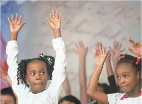  ?? PHOTOS BY ARIEL COBBERT/THE COMMERCIAL APPEAL ?? Second-grade scholars perform during “A Musical Journey Through Time,” an African-american History Month program at Dexter Elementary on Friday.