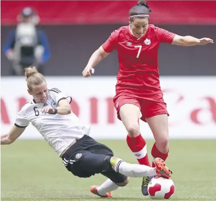  ?? JEFF VINNICK/BONGARTS/GETTY IMAGES FILES ?? Team Canada’s Rhian Wilkinson, right, attended Dorset Elementary School in Baie-d’Urfé and as a 12-year-old wrote in her yearbook that her ambition was to be a profession­al soccer player.