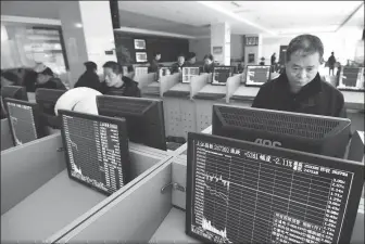  ??  ?? Investors track share prices at a brokerage in Fuyang city, Anhui province. Investors have shown enthusiasm for the science and technology innovation board, although details like agenda and rules of the new board are still unknown.