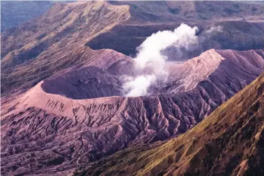  ??  ?? A SMOLDERING volcano. This past week, Bali’s Mount Agung volcano erupted, leaving thousands of tourists stranded.