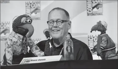  ?? The Associated Press ?? PUPPETEER: Puppeteer Dave Goelz, center, appears with Muppet characters Gonzo, left, and Rizzo the Rat during "The Muppets" panel at Comic-Con Internatio­nal on July 11, 2015, in San Diego. Goelz is one of many Muppet artists shedding light on their...
