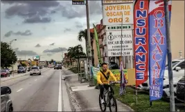  ?? THE NEW YORK TIMES ?? An insurance shop advertises Obamacare outside its storefront in Miami in 2022.