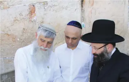  ?? (The Western Wall Heritage Foundation) ?? BRITISH HOME Secretary Sajid Javid with Western Wall Heritage Foundation directorge­neral, Mordechai Eliav, and Chief Rabbi Shmuel Rabinowitz.