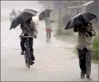  ?? AP/BISWARANJA­N ROUT ?? Chatrapur, India, walk toward a shelter Saturday as Cyclone Phailin slams the country’s eastern coastline.