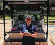  ??  ?? Martha Turner Sotheby’s Internatio­nal Realty agent Jessica Davis of their Katy office is keeping it cool by offering a neighborho­od snow-cone cart.