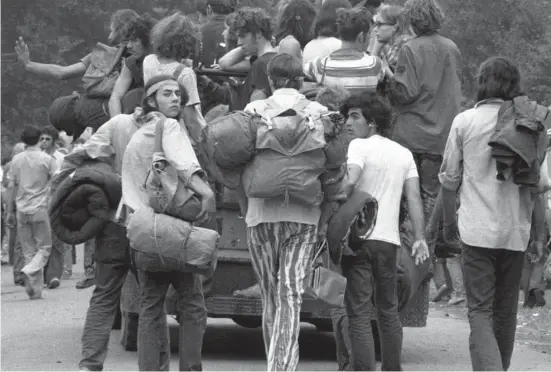  ?? NY Daily News Archive via Getty Images ?? After a week of drugs and disappoint­ment, youths abandon the Powder Ridge ski area in Middlefiel­d in late July 1970. The Powder Ridge Rock Festival, which had been scheduled, had long been canceled by court order. But 30,000 squatters had gone to site anyway.