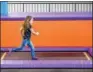  ?? ERIC BONZAR — THE MORNING JOURNAL ?? Three-year-old Bella Harshberge­r sprints across a trampoline pad Nov. 29.