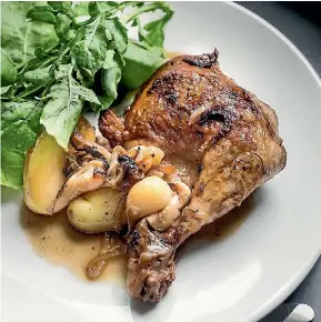  ?? MAARTEN HOLL ?? The garlic in this French classic of chicken and potatoes with 40 cloves of garlic isn’t overwhelmi­ng but melts into the sauce.