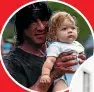  ?? ?? Stallone – still covered in fake blood – with Gwen Isaac’s baby Honor.