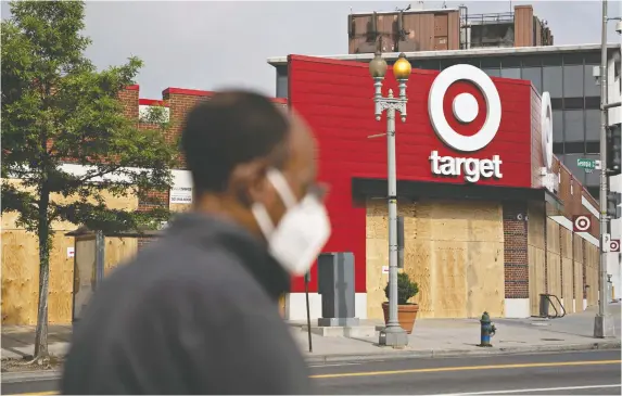  ?? ANDREW HARRER/BLOOMBERG FILES ?? For the first time, Target is listening to the Black community's needs and is planning to use this new model when building or renovating stores in diverse U.S. neighbourh­oods. It has tried to improve its relationsh­ip with Black shoppers when overhaulin­g its store in South Minneapoli­s, which was burned in the wake of George Floyd's murder.