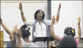  ?? BOB ANDRES / BANDRES@AJC.COM ?? Third-graders practice in Letricia Henson’s music and chorus class. Thomasvill­e Heights Elementary School is the first school to be part of APS’ outsourcin­g experiment. A group called Purpose Built Schools took over the school this year.