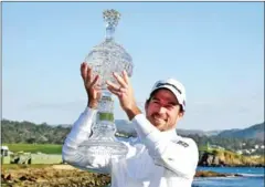  ?? AFP ?? Nick Taylor of Canada poses with the trophy after winning the AT&T Pebble Beach Pro-Am at Pebble Beach Golf Links on Sunday.