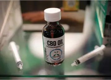  ?? (Mike Segar/Reuters) ?? CBD OIL on display at a trade show in New York City.