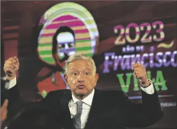  ?? MARCO UGARTE/AP ?? MEXICAN PRESIDENT ANDRES MANUEL LOPEZ OBRADOR gives his regularly scheduled morning press conference, decorated with an image of Francisco “Pancho” Villa, a general in the Mexican Revolution, at the National Palace in Mexico City on Tuesday.