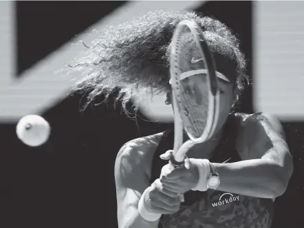  ?? Andy Brownbill / Associated Press ?? Naomi Osaka hits a backhand to Serena Williams during their semifinal match at the Australian Open. Osaka beat Williams 6-3, 6-4.