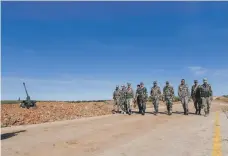  ?? AFP ?? Syrian regime soldiers near Manbij after Damascus clinched a deal for its troops to move into the Kurdish-run north-east