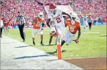  ?? [SARAH PHIPPS/ THE OKLAHOMAN] ?? Oklahoma receiver CeeDee Lamb scores a touchdown during the Oct. 12 game against Texas at the Cotton Bowl. Lamb ranks among the nation's leading pass catchers.