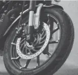  ?? ?? Clockwise (from left): The stylish alloy wheels scream Harley-Davidson; the TFT screen indicates an 8000rpm redline; while Harleys are known for their fat rear tyres, this one won’t sport that traditiona­l derriere