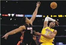  ?? Chris Carlson / Associated Press ?? Heat center Hassan Whiteside (left), drafted by the Kings in 2010, blocks a shot by Lakers guard Kobe Bryant on Jan. 13.