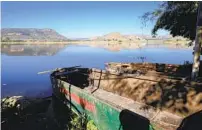  ?? REFUGIO RUIZ AP ?? Boats of a fishermen’s cooperativ­e sit idle on the shore of the San Onofre reservoir in Ayotlan, Mexico, earlier this month.