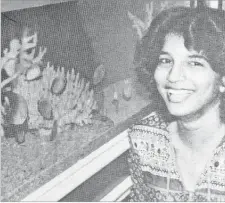  ?? Picture: FT FILE ?? Sales assistant of the Suva Aquarium Marie Joseph, 20, shows a tank full of fish and coral.