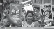  ?? REUTERS ?? People hold placards during a march to protest against atrocities ■ on women, in Ahmedabad on Friday.