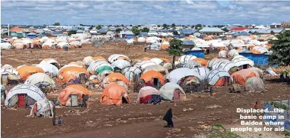  ?? ?? Displaced...the basic camp in Baidoa where people go for aid