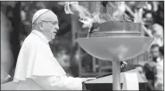  ?? AP/ANDREW MEDICHINI ?? Pope Francis speaks next to a “reconcilia­tion flame” Thursday during a ceremony at the presidenti­al palace in Bogota, Colombia.