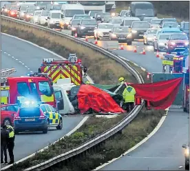  ??  ?? CARNAGE: The scene of the crash on the M40 that killed three