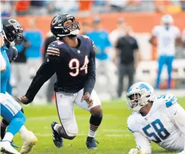  ?? CHRIS SWEDA/CHICAGO TRIBUNE ?? Bears linebacker Robert Quinn looks toward the ball after it was stripped, resulting in a fumble by Lions quarterbac­k Jared Goff on Sunday.