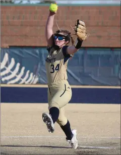  ?? BRYAN EVERSON — MEDIANEWS GROUP ?? Detroit Country Day freshman Juliette Hauser delivers a pitch in Monday’s season opener at home against Farmington Hills Mercy.