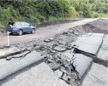  ??  ?? A section of the Junction main road in St Mary which collapsed on Monday night.